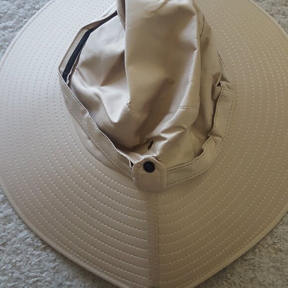 New, never-worn tan hiking hat with wide brim, drawstring for secure fit - Picture 2 of 4